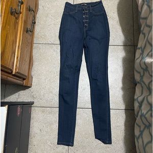 Fashion nova high waist jean .